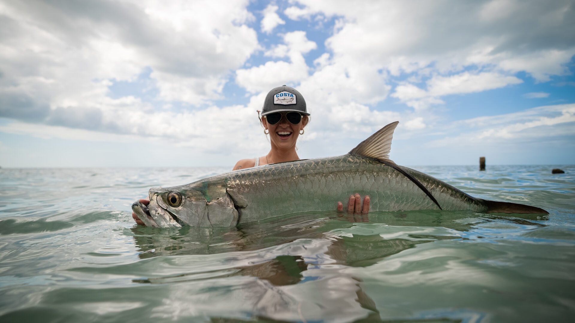 TARPON IN WATER W LADY ANGLER-1b5fc1c